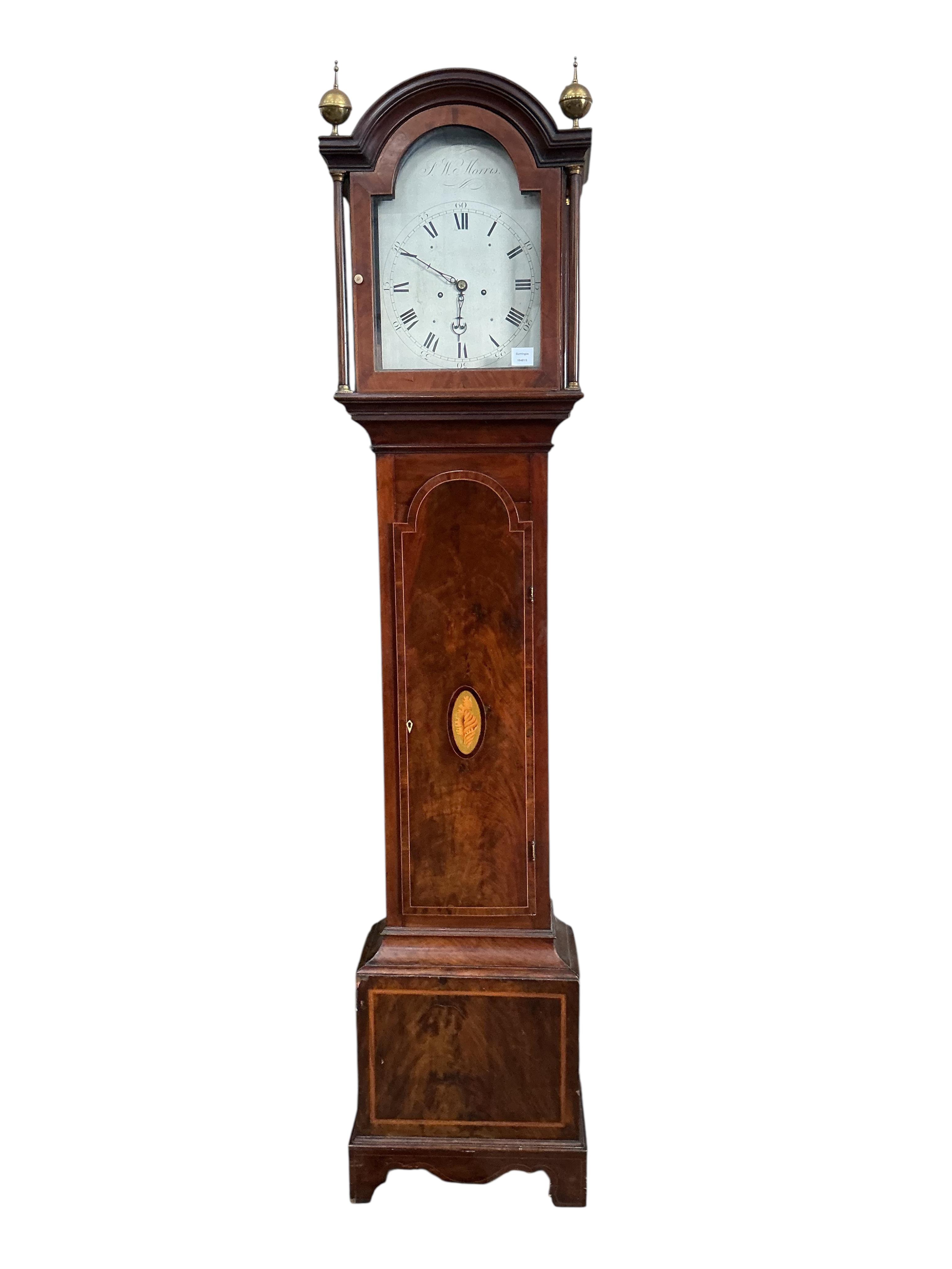 A George III inlaid mahogany eight day longcase clock, the silvered dial marked J.W. Morris, height 218cm